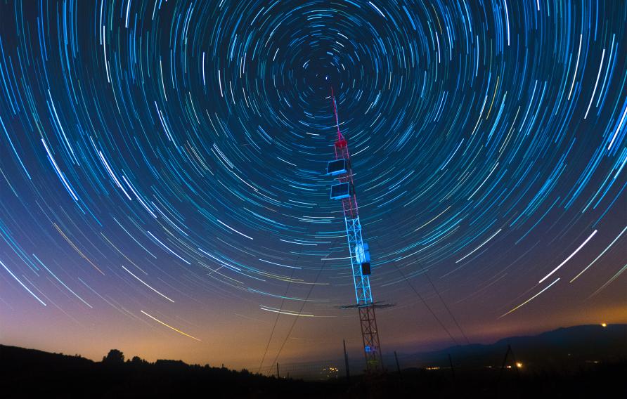 time lapse image of stars moving around sky
