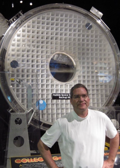 Carl Widrig with space telescope mirrors